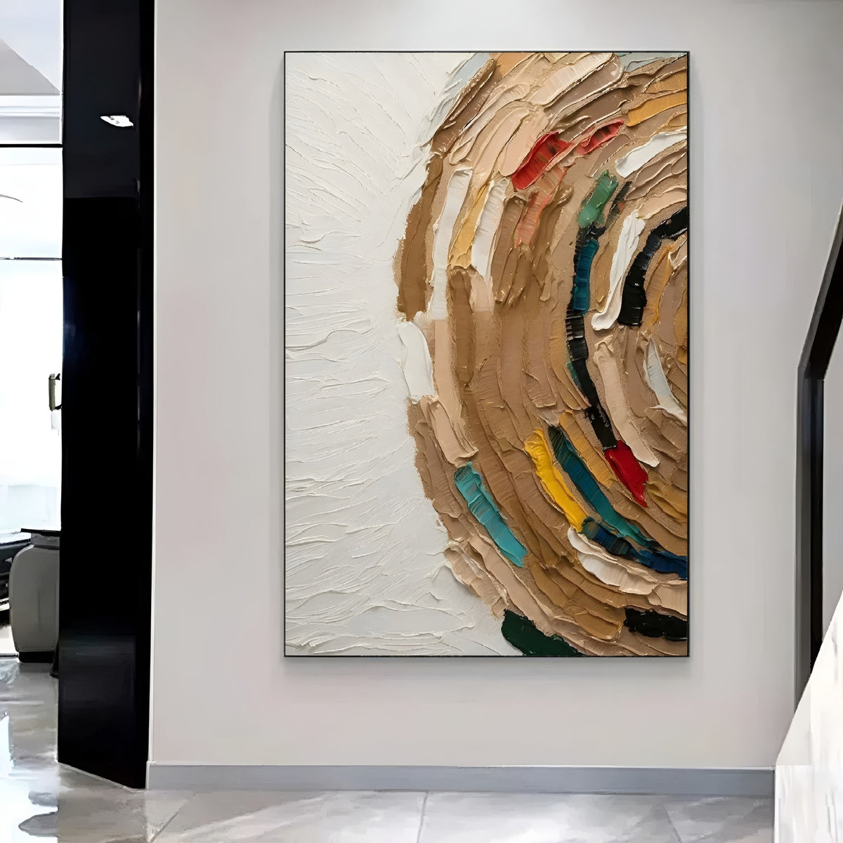 Contemporary art piece showcasing a dynamic, circular swirl of earthy tones mixed with splashes of primary colors, displayed above a clean white sofa.